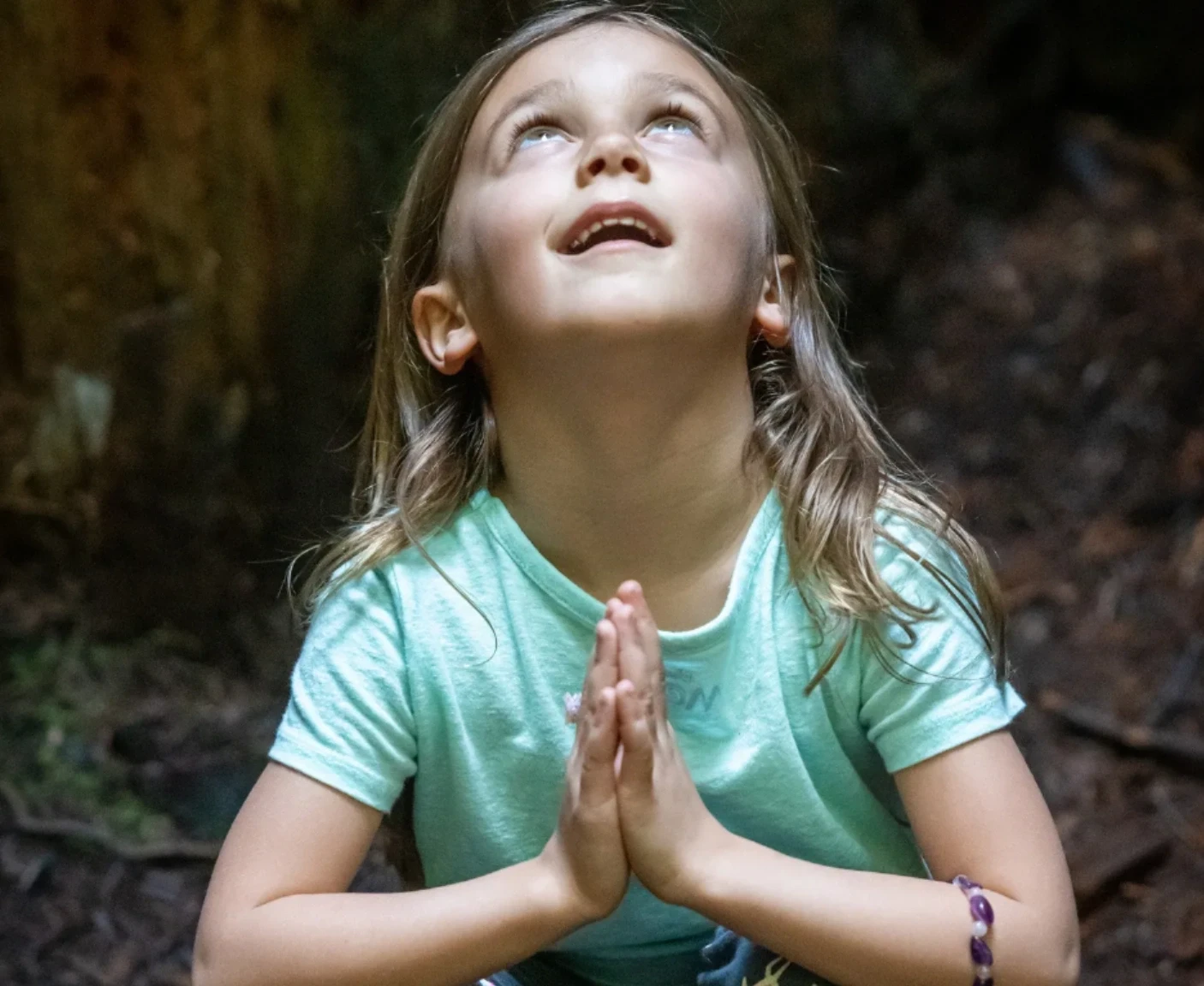 Child in prayer — faith and compassion