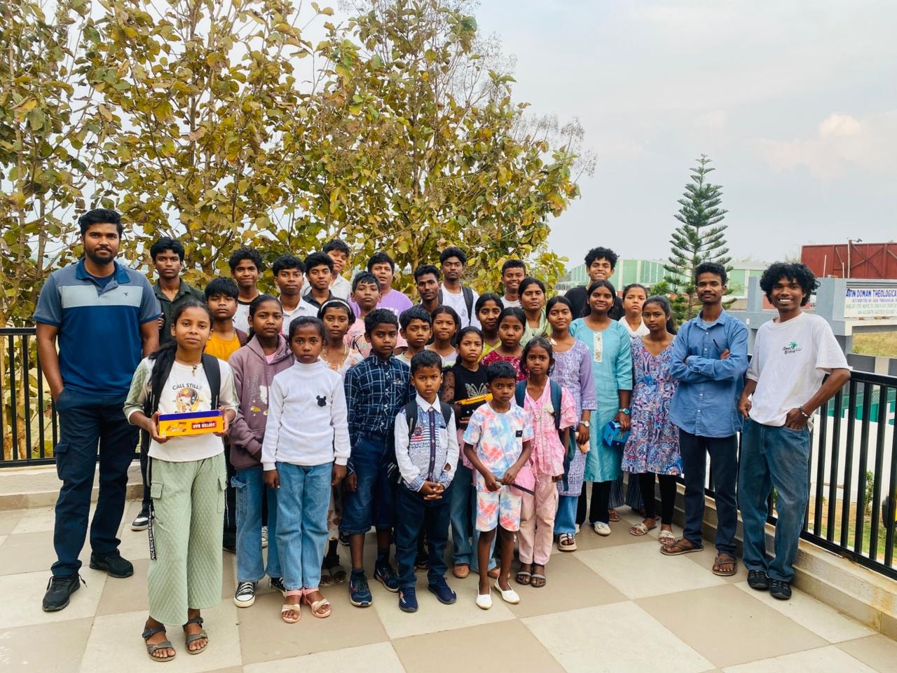 Group photo of young people at an outdoor event