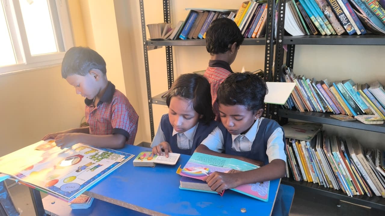 Children reading books in the library