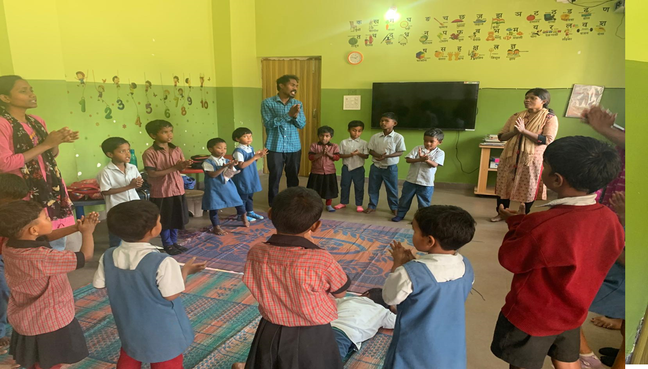 Teacher reviewing work with students
