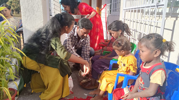 Teachers washing the feet of children on the first day of school