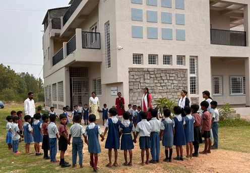 Students and staff gathered outside the school building